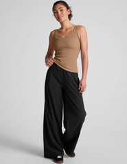brown classic length tank top with a soft V neckline front and back, overlapping front neckline detail, and a performance lining shelf bra. Tank hits at a high hip length.