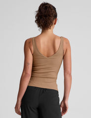 brown classic length tank top with a soft V neckline front and back, overlapping front neckline detail, and a performance lining shelf bra. Tank hits at a high hip length.