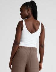 white ribbed tank top with a soft front and back v neckline.