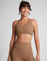 brown ribbed racerback bra with overlapping hemband detail and a scoop neckline.
