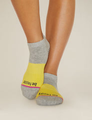 grey and yellow ankle socks with the mantra be happy printed.