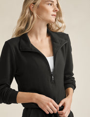 black half zip knit jumpsuit with drawstring at waist