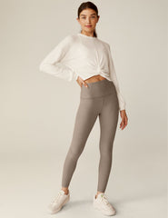 white crew neck relaxed fit cropped pullover with a detailing twist at front waist.