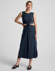 blue midi length thick strap tank dress with cutouts on sides of the waist and side slits on both sides of leg.