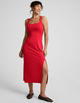 red square neck midi length dress with a front side slit.