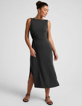 black midi dress with a bateau neck and side twist.