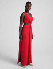 red maxi length tank dress with a v neckline and cutouts at waist.