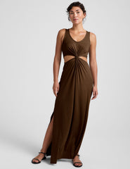 brown maxi length dress with a v neckline and cutouts at waist.