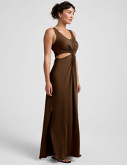 brown maxi length dress with a v neckline and cutouts at waist.