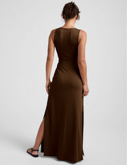 brown maxi length dress with a v neckline and cutouts at waist.