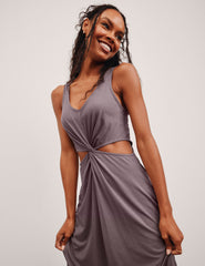 brown v-neck tank maxi length dress with cutouts at the waist.