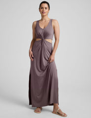 brown v-neck tank maxi length dress with cutouts at the waist.