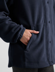 blue fleece button up jacket with a full front zip and snap closures and pockets.