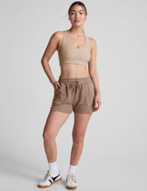 brown shorts with patch pockets and a drawstring at the waistband.
