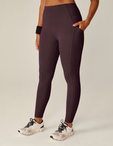 purple midi length leggings with pockets.