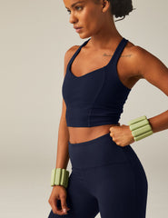 navy blue racerback cropped tank top with a built-in bra and princess seams.