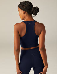 navy blue racerback cropped tank top with a built-in bra and princess seams.