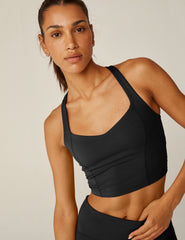 black v-neck racerback cropped POWERBEYOND tank top.