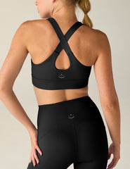 black scoop neck bra with crossover back detail.