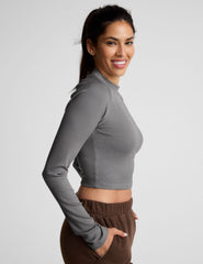gray ribbed mock-neck cropped long sleeve top.