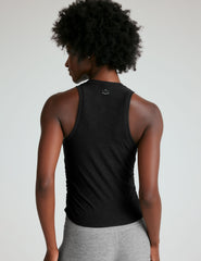 black scoop neck tank top with shirring details down the sides.