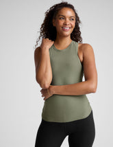 green scoop neck tank top with shirred detailing on the sides.