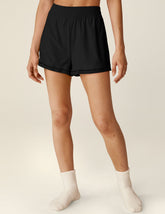 black mini shorts with a lace trim and elastic waistband.