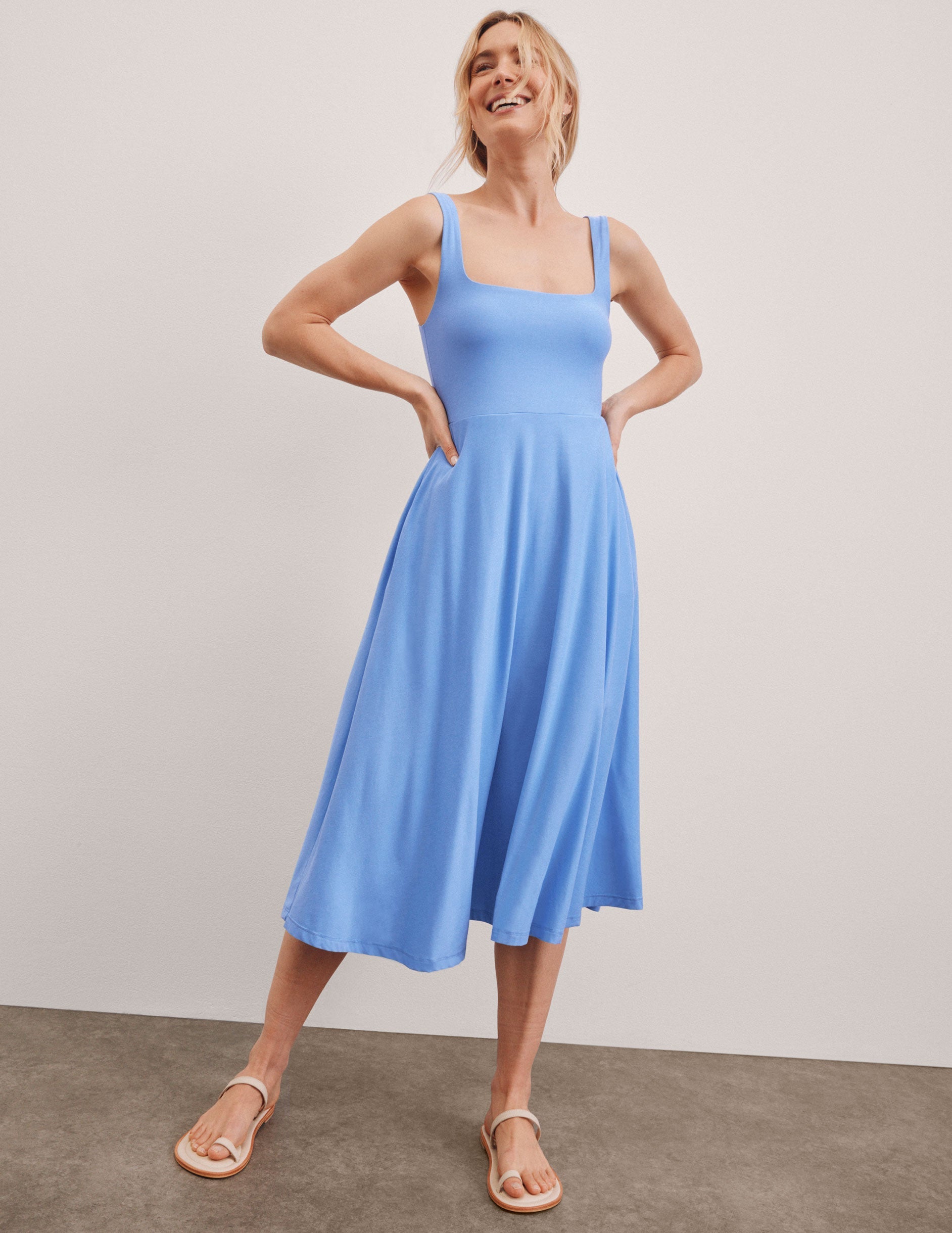 blue square neck midi length tank dress with pockets.