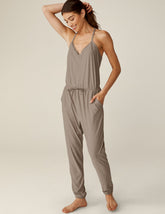 brown midi jumpsuit with a drawstring at waistband and lace trim detailing.