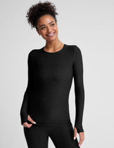 black crew neck long sleeve top with thumb holes.