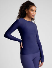 blue long sleeve top with a crew neckline.
