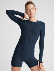 blue long sleeve crew neck top with thumb holes.