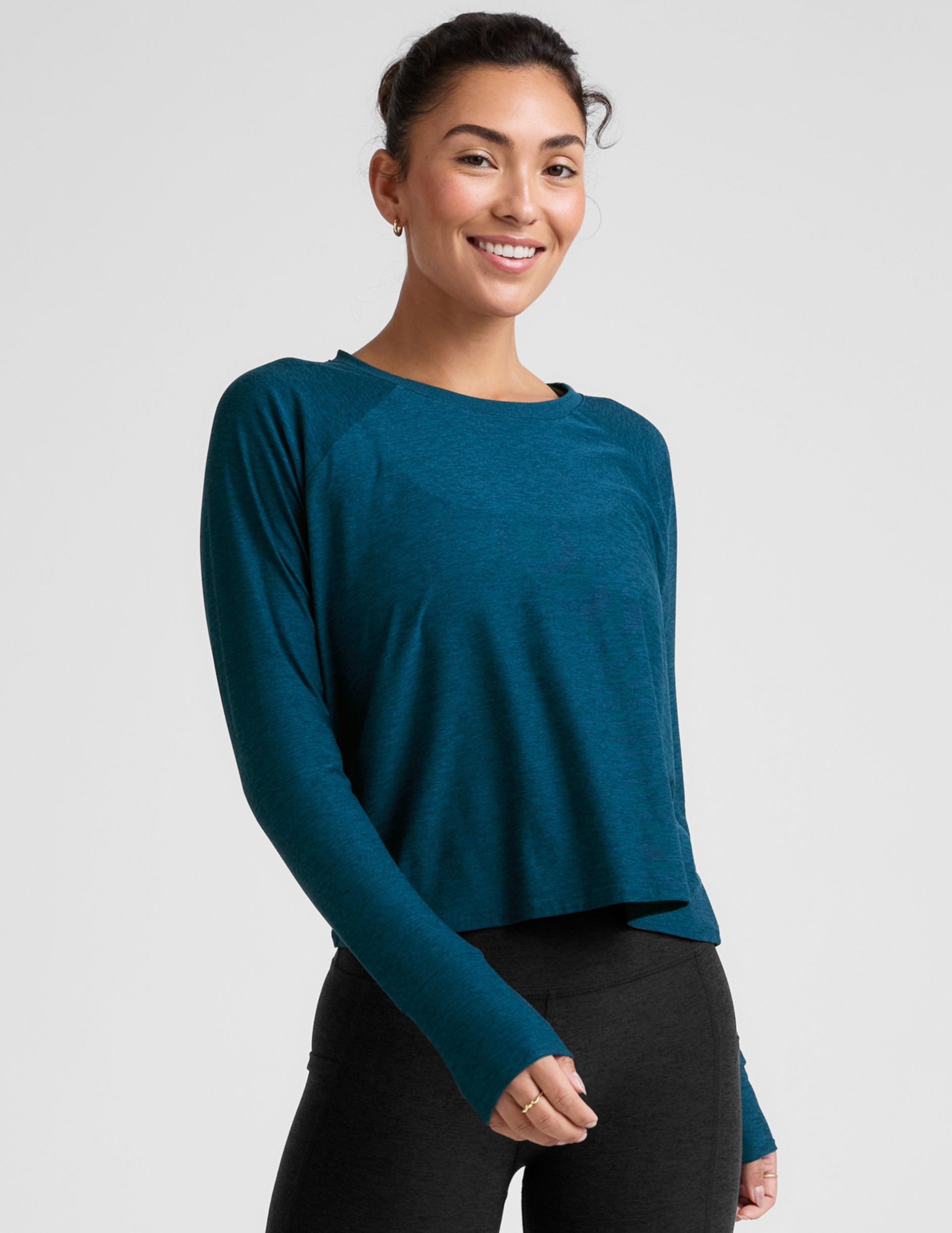 blue long sleeve crew neck top.
