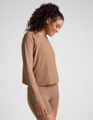 brown long sleeve top with a scoop neckline.