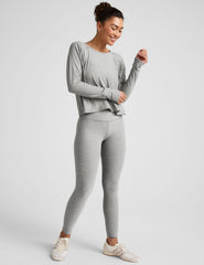 gray long sleeve crew neck top.