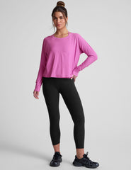pink long sleeve relaxed fit top with a scoop neckline.
