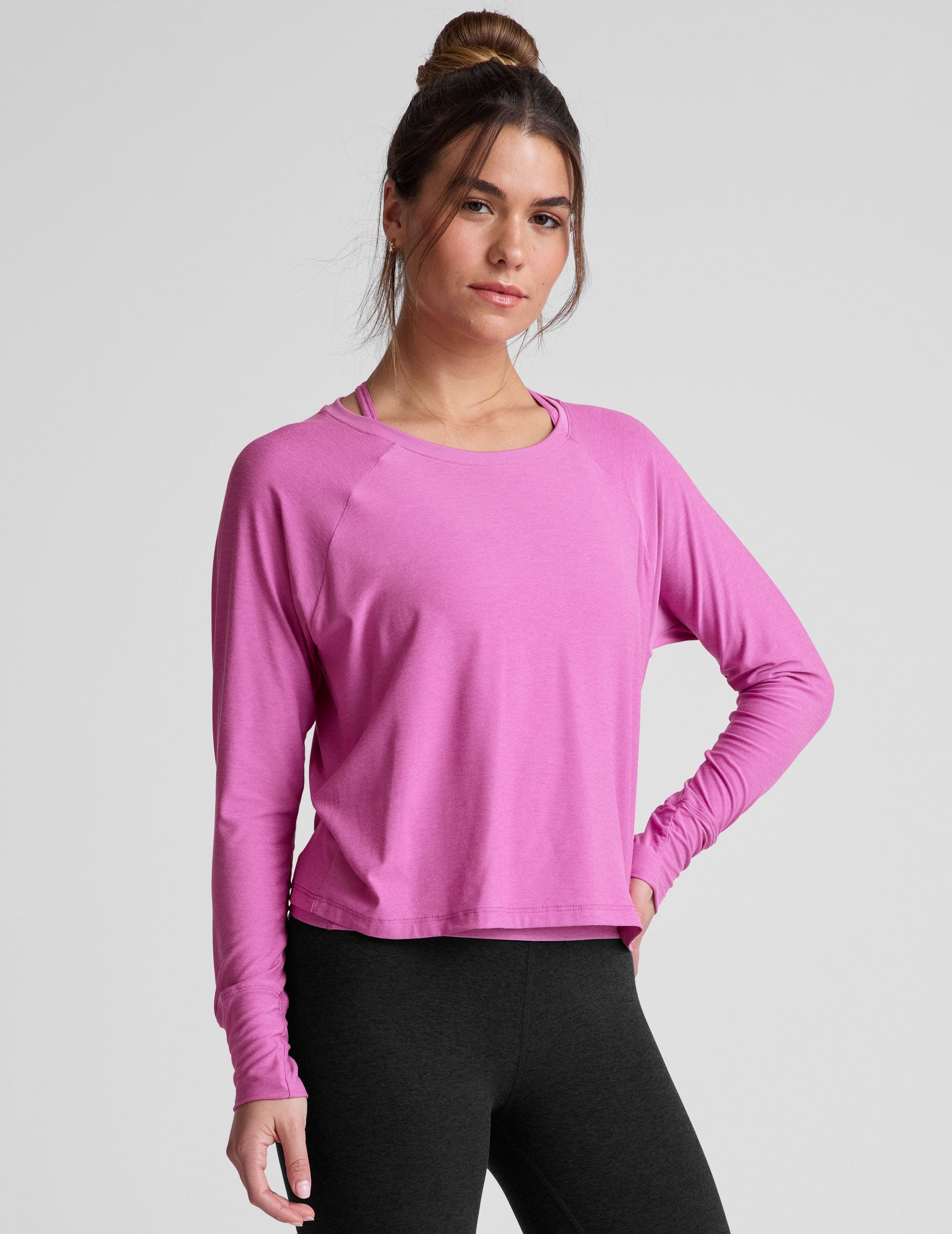 pink long sleeve relaxed fit top with a scoop neckline.