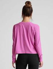 pink long sleeve relaxed fit top with a scoop neckline.