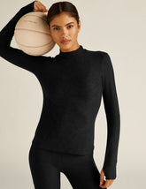 black mock neck pullover.