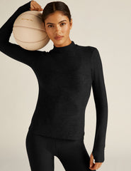 black mock neck pullover.