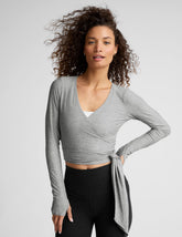 gray long sleeve wrap top with thumb holes.
