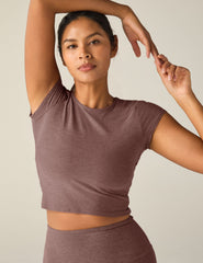 red short sleeve cropped t-shirt with a cutout detail on back.