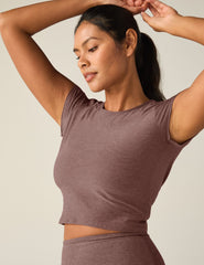 red short sleeve cropped t-shirt with a cutout detail on back.