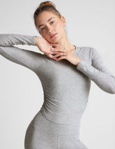 gray long sleeve top.