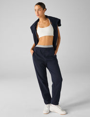 blue jogger style sweatpants with pockets.