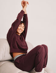 red sweatpants with pockets and a drawstring at waistband.