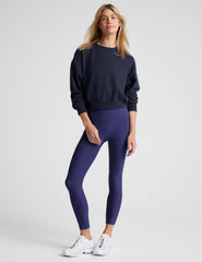blue loose-fitting classic length crew neck sweatshirt.