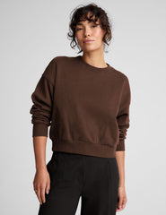brown loose-fitting classic length crew neck sweatshirt.