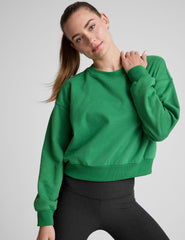 green crew neck sweatshirt.