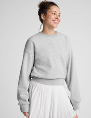 gray loose-fitting classic length crew neck sweatshirt.